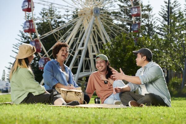 International students socialising and taking a selfie at Fremantle Oval, Fremantle